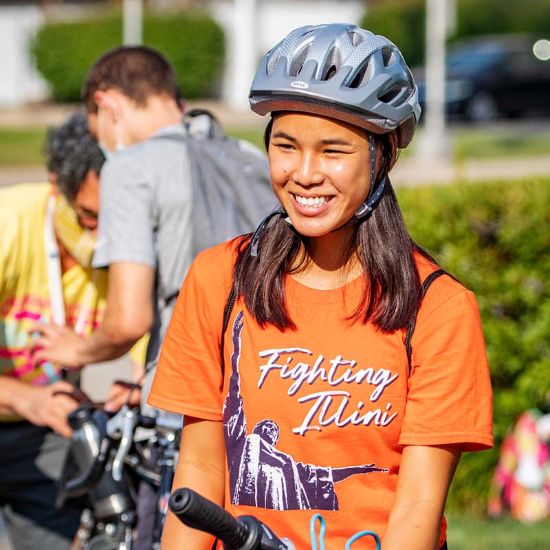 student wearing a bike helmet