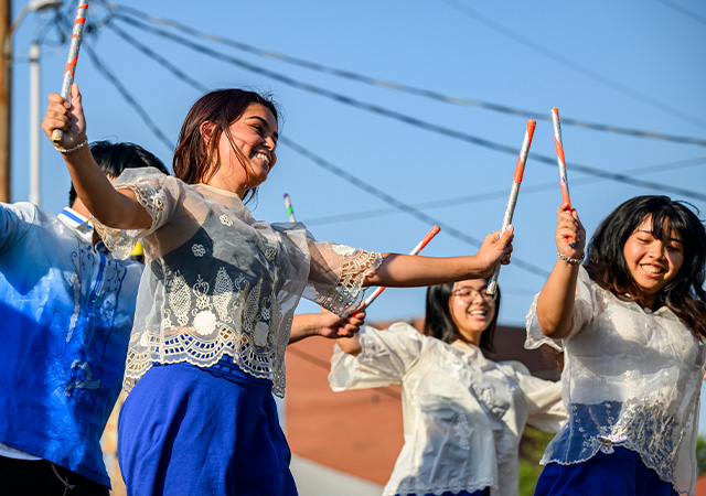 Student members of PSA Barkada perform at the Asian American Cultural Center & International Education Open House.