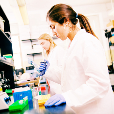 two female Illinois students in a lab completing an experiment
