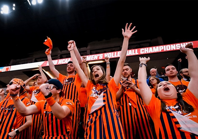 Illini Pride members cheer on the Illini Men's Basketball team
