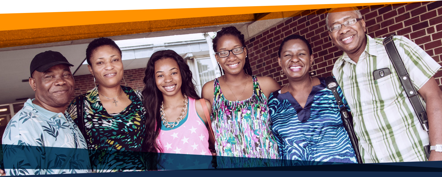 two families at summer registration