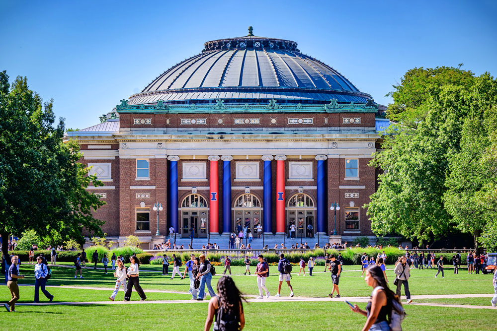Foellinger Auditorium sits on the south end of a bustling Quad full of students on a beautiful spring day