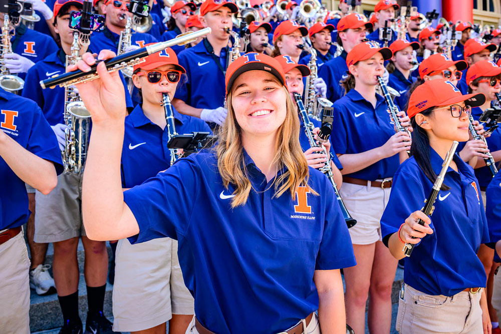 closeup of Marching Illini member holding up their instrument during a performance at Quad Day