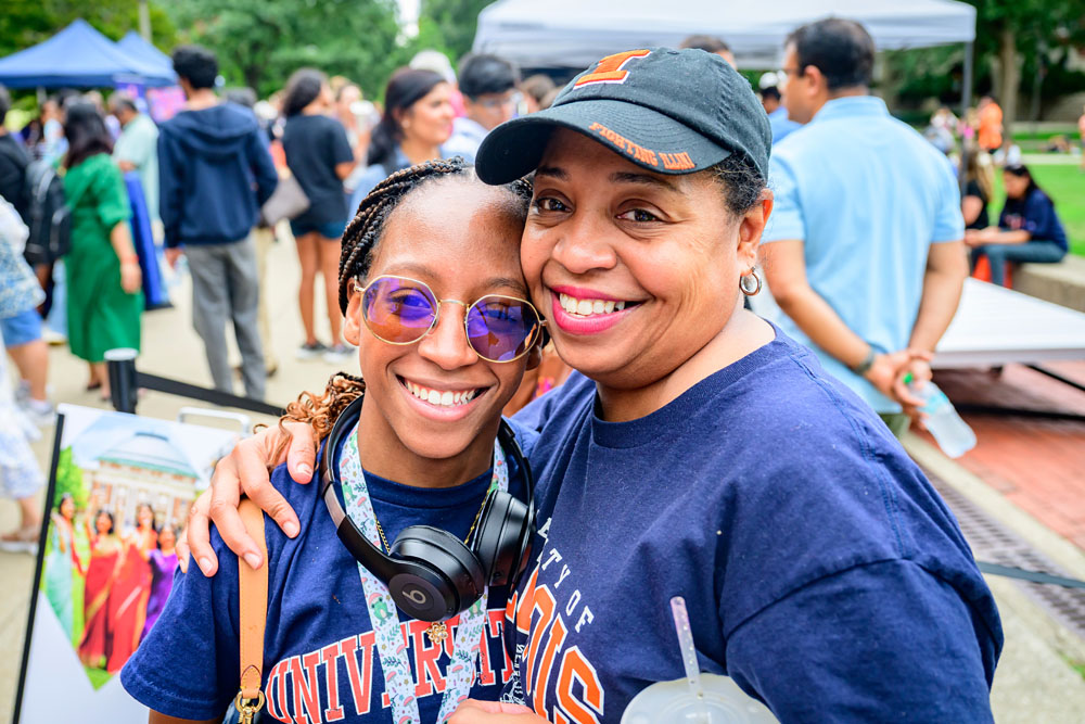 mother and daughter in Illinois gear attend at family send-off event outside the Illini Union