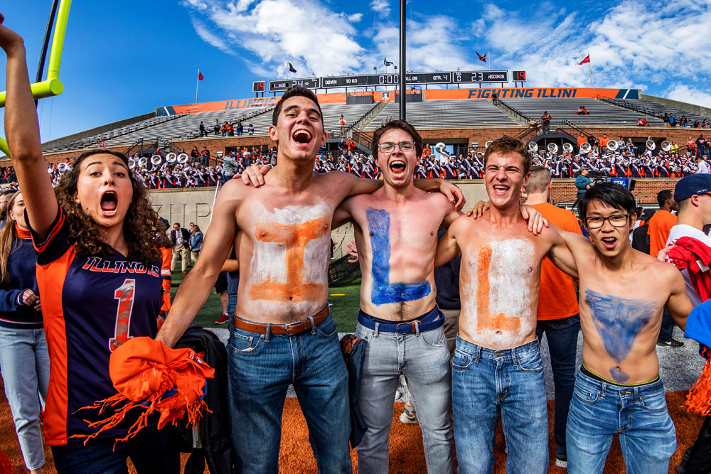 Block I fans themselves with I-L-L and cheer on Illinois football