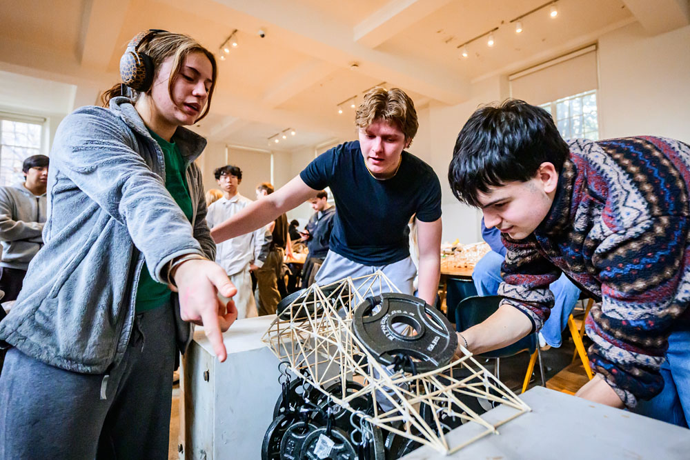 architecture student team completing a truss project for Architecture 232: Structural Fundamentals in Temple Buell Architecture Gallery