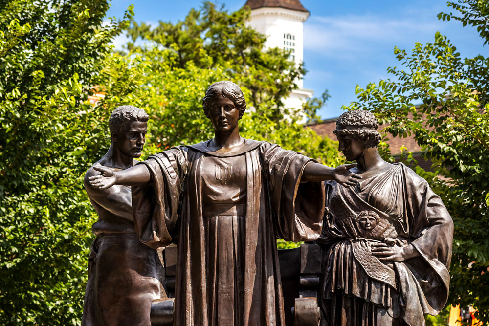 Alma Mater statue stands with Learning & Labor with Illini Union in the background