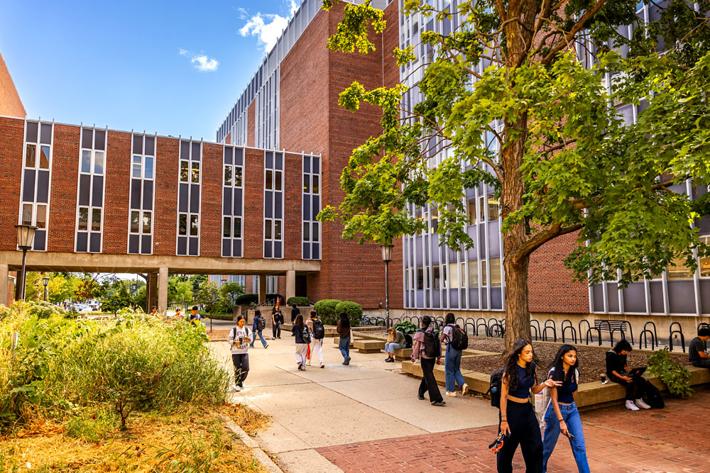 students pass through Burrill and Morrill Halls on their way to the Quad for the first day of classes