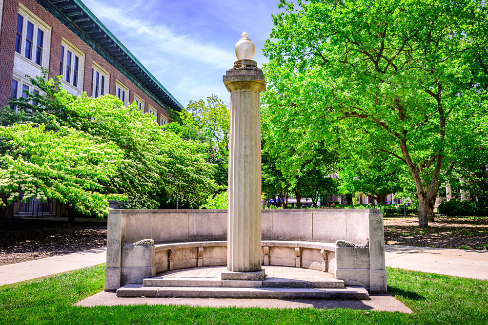 the Eternal Flame sitting between the English Building and Lincoln Hall on the Quad