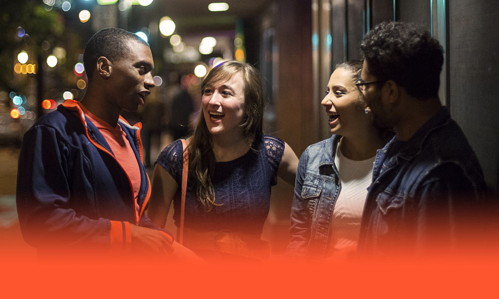group of friends hanging out on Green Street in the evening